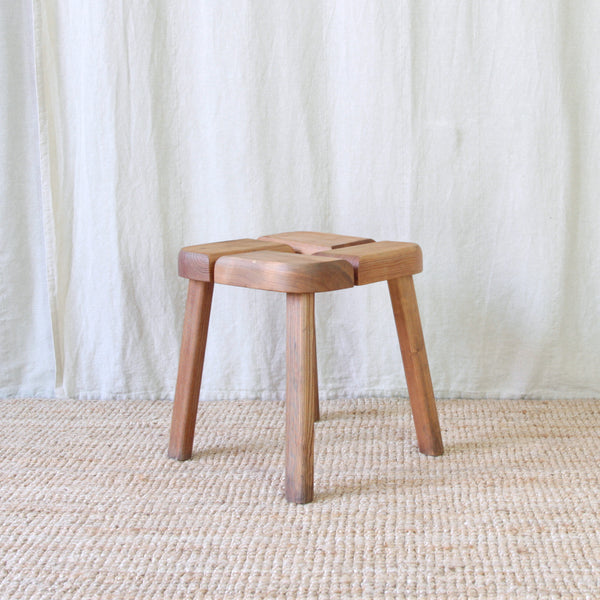 Sculptural Olof Ottelin pine stool combining traditional Finnish woodworking with a bold, architectural mid-century geometric form.