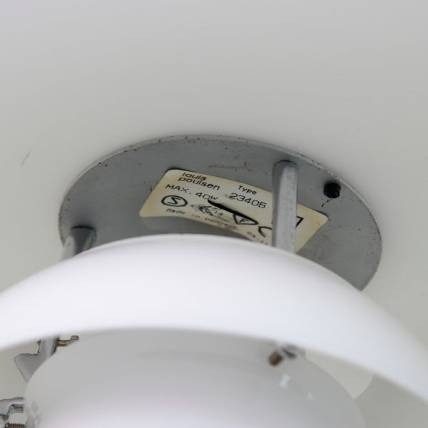 Close-up of Poul Henningsen PH 3/2 lamp, with curved opaline glass controlling reflection and glare. The original Louis Poulsen sticker showing the lights model number is still present. The manufacturers sticker reads Type 23405. Made in Denmark.