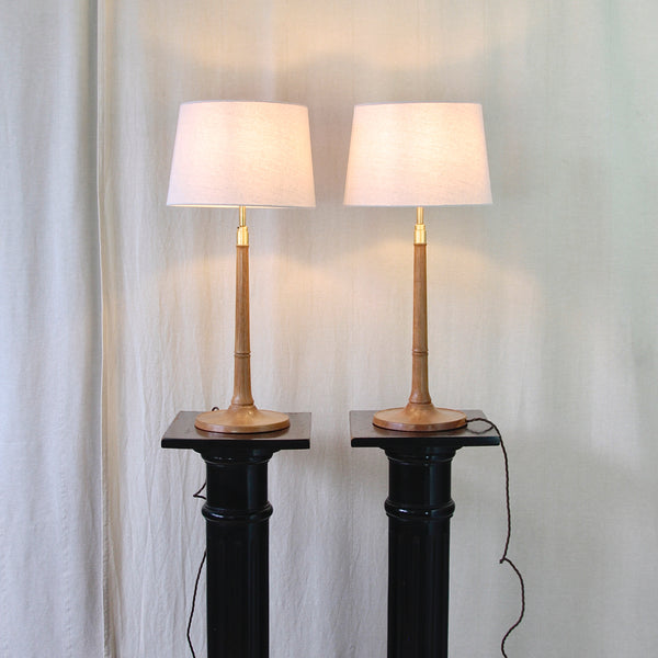 Matching pair of vintage Le Klint Model 301/27 lamps by Danish designer Esben Klint, turned from solid oak with brass details.