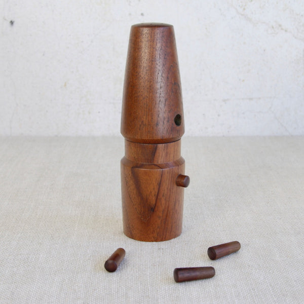 Teak wood pepper grinder with its three wooden pegs removed. Collectible Jens Quistgaard Vanguard mill for Dansk Designs, authentic mid-century Danish design piece.