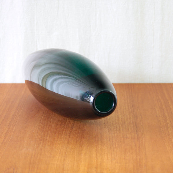 Large elliptical Grønland vase by Per Lütken for Holmegaard, with an elongated free-blown form in deep Mørkegrøn glass.