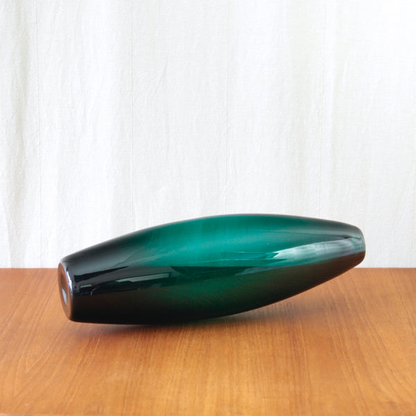 Monolithic dark green glass vase by Per Lütken, its uninterrupted 41cm form creating a powerful sculptural silhouette.