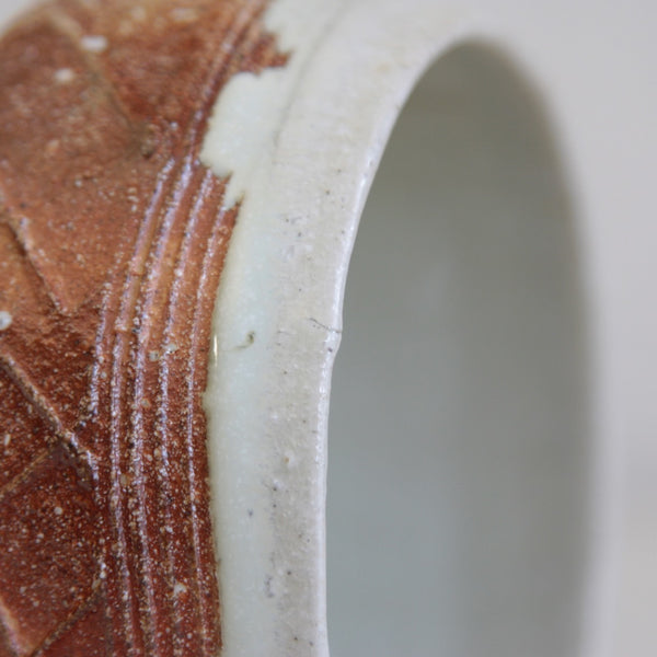 Close-up of Phil Rogers chawan highlighting lattice pattern and natural variations from wood firing.