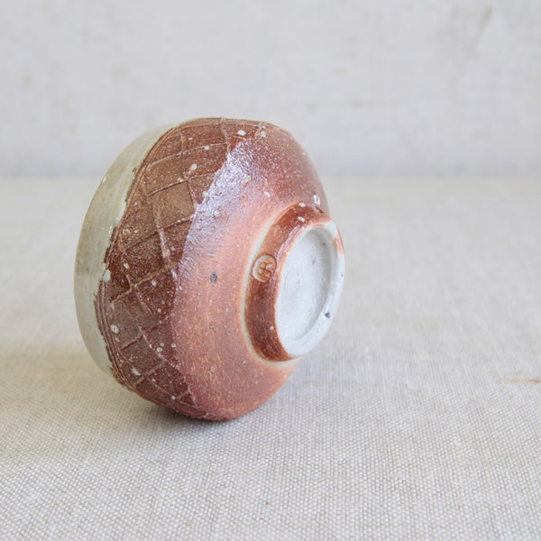 Anglo-Oriental chawan by Phil Rogers with natural wood-fired surface effects and balanced footed form. Double stamped.