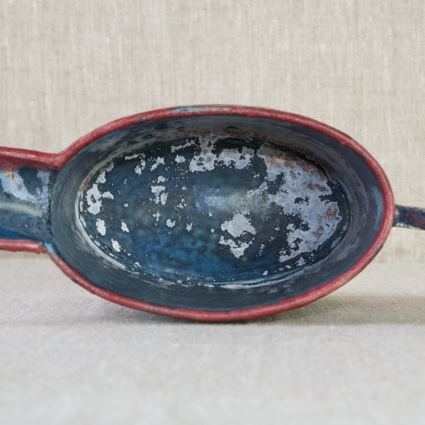 Zoomed in image of the inside of an Emmanuel Cooper jug. The interior is glazed entirely. The colours are navy-blue and sky-blue. Emmanuel Cooper was an expert in glazes and glazing techniques.  