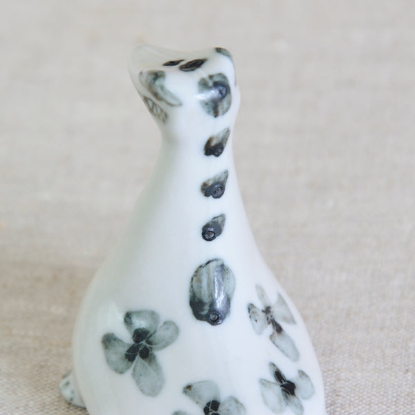 Susan Parkinson Nessie figurine with reptilian head, zig-zag grin and distinctive fin-like tail