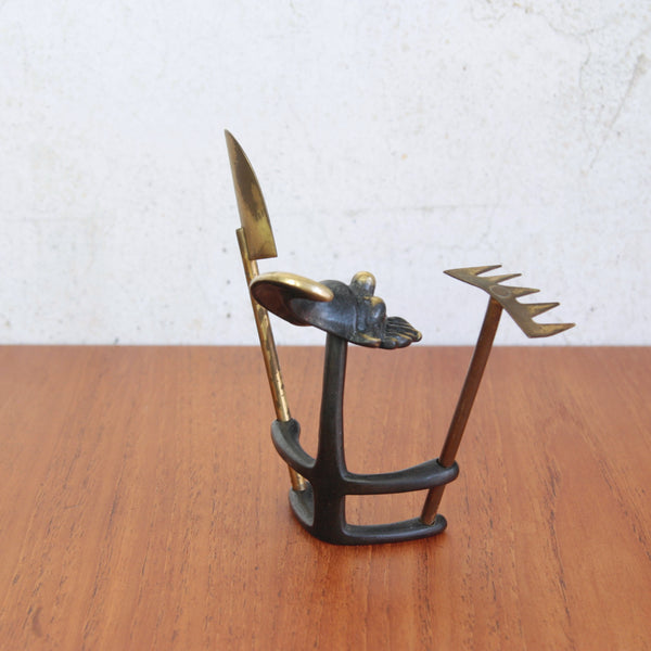 Brass bonsai gnome by Walter Bosse, holding rake and spade, perfect desk or shelf decoration.