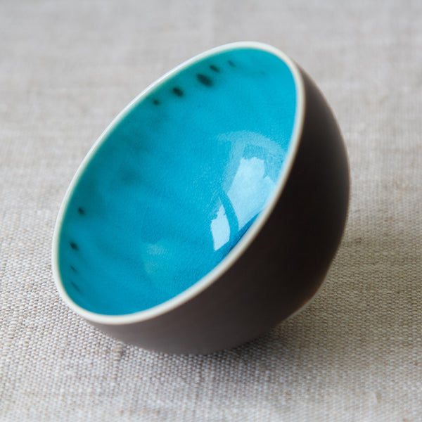 Bright blue gloss glaze inside an Arabia Finland small porcelain bowl, designed by Friedl Holzer-Kjellberg, 1950's
