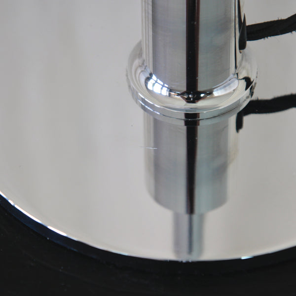 Close-up of mark on a polished chrome lamp base. Vintage Poul Henningsen PH 3/2 table lamp Type 23405, available from UK design gallery Art & Utility.