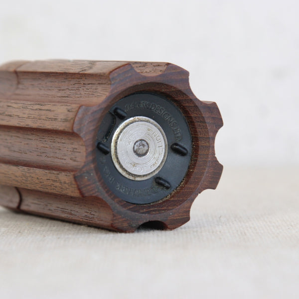 Metal and black plastic transitional grinder mechanism on a rare Jens Quistgaard model 858 "Bullet" pepper mill for Dansk Designs.