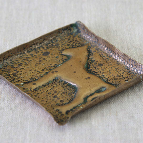 Repoussé horse brass vide-poche, a unique handmade decorative dish with a raised horse design and hand-worked texture.