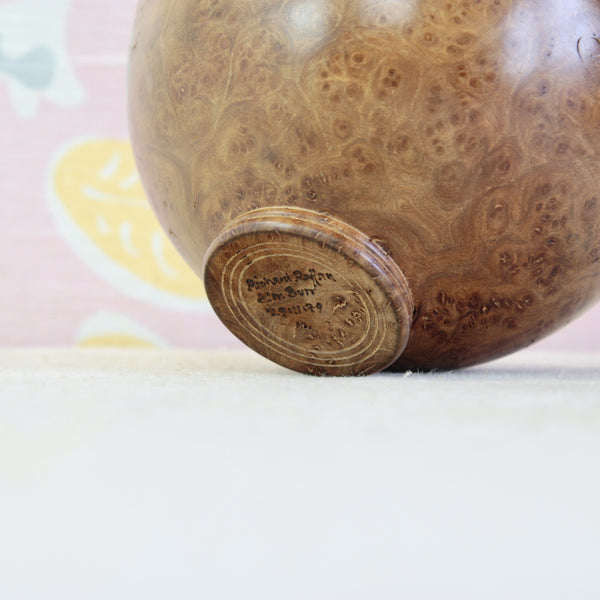 Detail of the highly figured elm burr bowl by Richard Raffan, with complex organic grain patterns. Base bares hand written signature that reads 'Richard Raffan Elm Burr 29:11:79'
