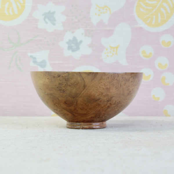 Richard Raffan 1979 studio pottery-style wooden bowl in highly figured elm burr, with a simple restrained profile and broad rounded body.