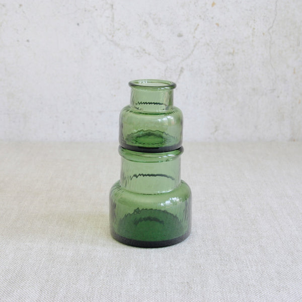 Playful image showing Finnish modern glass vases stacked on top of each other. Design by Nanny Still from the Neptuna series, produced by Riihimäen Lasi in 1964.
