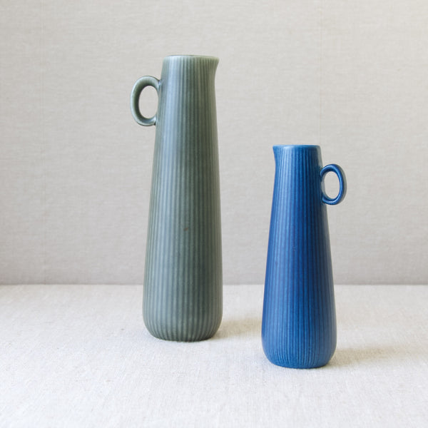 Rörstrand Sweden pair of 'Ritzi' ceramic vases designed by Gunnar Nylund in the 1960's. They have a ribbed underglaze texture and long, tapered form. 