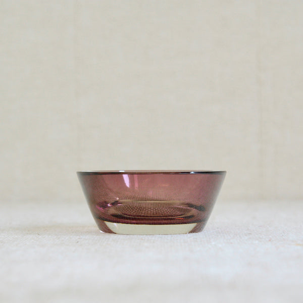 A hand-blown, cased glass candleholder votive in clear and pink, designed in 1956 by&nbsp;Saara Hopea for Nuutajärvi Notsjö, Finland.