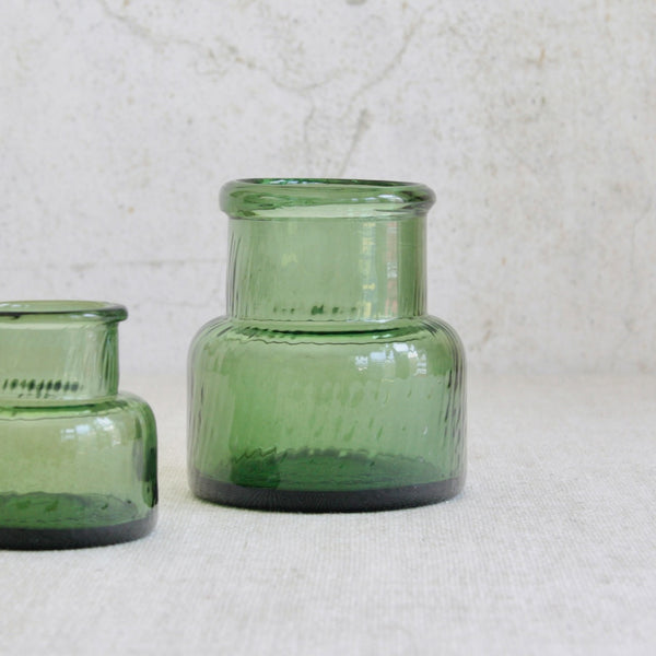 Detail of large Nanny Still Neptuna vase in sea-green glass, handmade at Riihimäen Lasi using traditional optical mould techniques.
