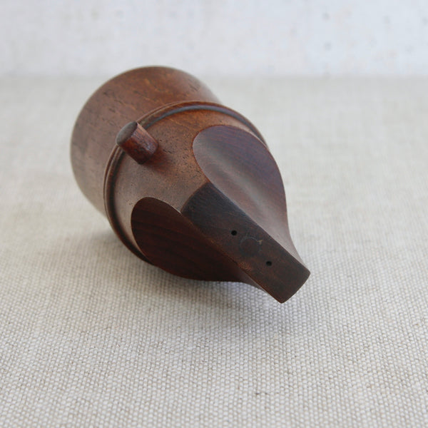 A mid-century Scandinavian teak “flathead” pepper mill designed by Jens Quistgaard for Dansk Designs, showcasing clean modernist form and fine timber grain.
