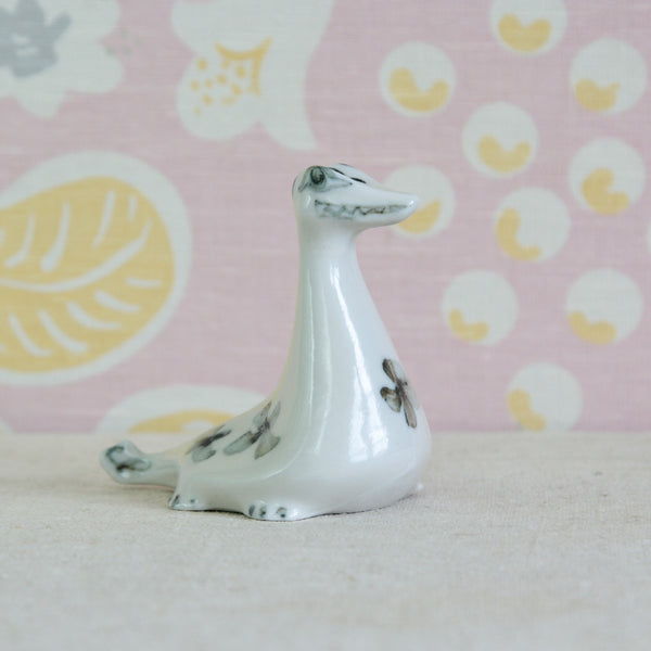 Susan Parkinson Nessie porcelain Loch Ness Monster figurine, designed at Parkinson Pottery circa 1955. Rare Post-War British design.