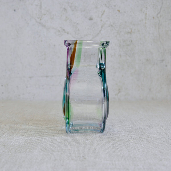 Multicolored glass vessel, Helena Tynell Bora Bora vase with crystal-clear glass and softly coloured interior swirl, made by Riihimäen Lasi in Finland.