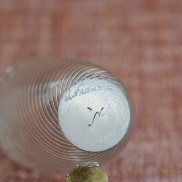Close-up of the hand painted acid etched signature on the base / underside of a Vire vase designed by Kaj Franck for Nuutajärvi Notsjö Glassworks, Finland.