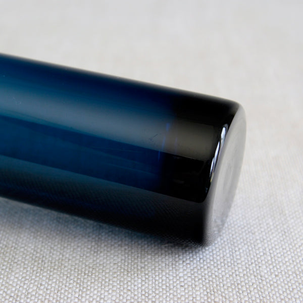 Close up of a mid-century Finnish art glass vase Katedraali, hand-blown turquoise by Helena Tynell.