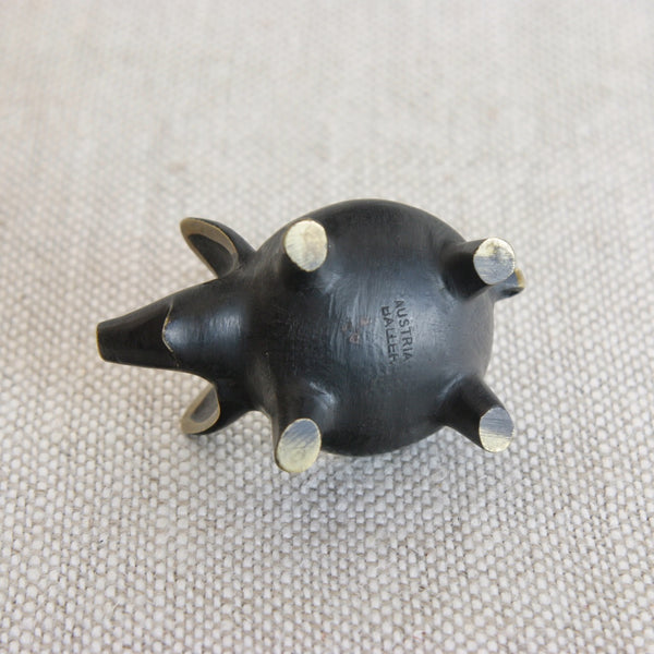 Detail showing stamped signature / manufacturers maker mark on the underside of a Vienna bronze pig designed by Walter Bosse for Herta Baller in Austria.