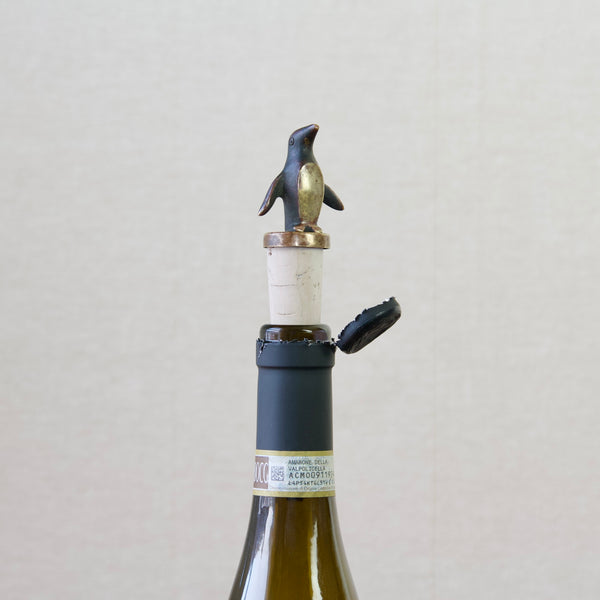 Elevate your home bar with a touch of whimsy with this Walter Bosse designed penguin bottle stopper.