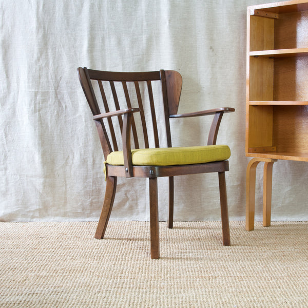 Mood shot of Christian E. Hansen's 'Canada' armchair, a midcentury modern classic made by Danish cabinet maker Fritz Hansen.