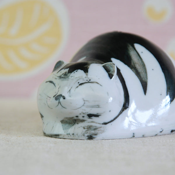 Susan Parkinson Money Cat, a sleeping cat money box in hand-decorated porcelain
