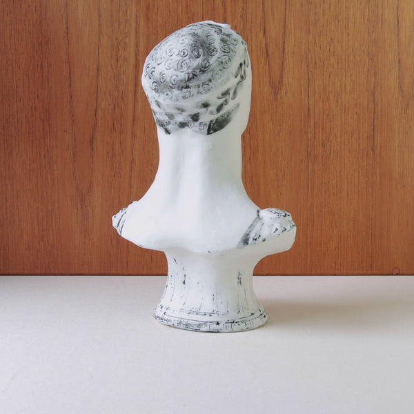 Vintage British ceramic sculpture by Susan Parkinson, with black and white contrasts defining a flowing tunic and curly hair.