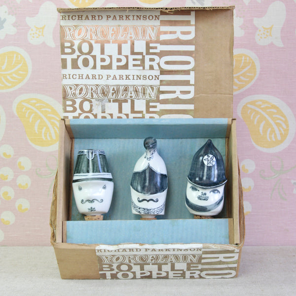 Susan Parkinson and Guy Neale porcelain bottle stopper trio for Parkinson Pottery, circa 1955, depicting a Policeman, Cavalry Officer and French Gendarme.