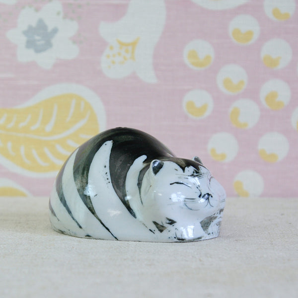 Susan Parkinson Money Cat porcelain figure showing its rounded, overfed feline form