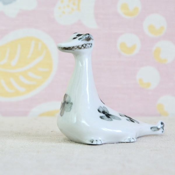 Susan Parkinson Nessie, a characterful Parkinson Pottery creature with large eyes and zig-zagged grin. The black and white decoration is related to the Picassoettes. Namely, William Newland, Margaret Hine, Nicholas Vergette, James Tower and Dora Billington.