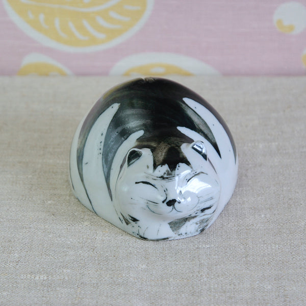 Susan Parkinson sleeping cat, a hand-decorated porcelain money box from circa 1960