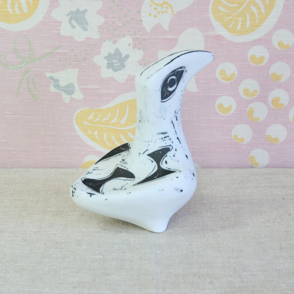 A white ceramic bird figurine with black painted details, a post-war British ceramic design inspired by James Tower. Susan Parkinson created the Large Bird circa 1953.
