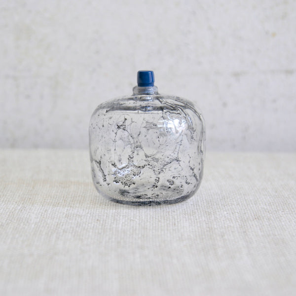 Collectible Swedish art glass bottle featuring ocean like bubbles and handmade blue stopper. Orrefors Expo piece.