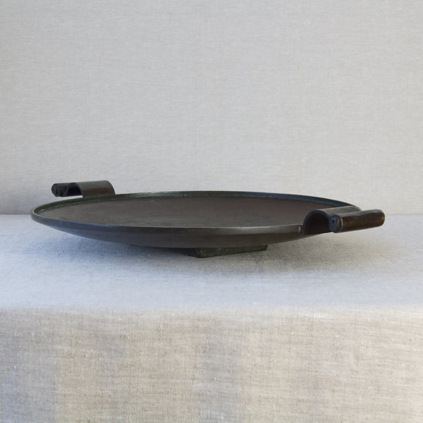 Side view of a large heavily patinated bronze platter by Einar & Sune Bäckström of Malmo, Sweden. This is a highly collectible piece of Swedish Grace design, for sale in London.