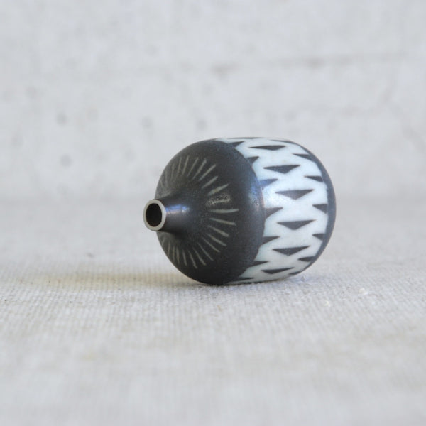 Small decorative vase by Gunnar Nylund showcasing geometric design for Rörstrand
