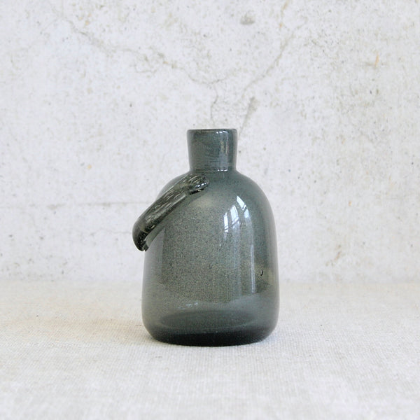 Erik Höglund human-shaped bottle vase in glittering Carborundum glass, an iconic example of Swedish mid-century glass experimentation.