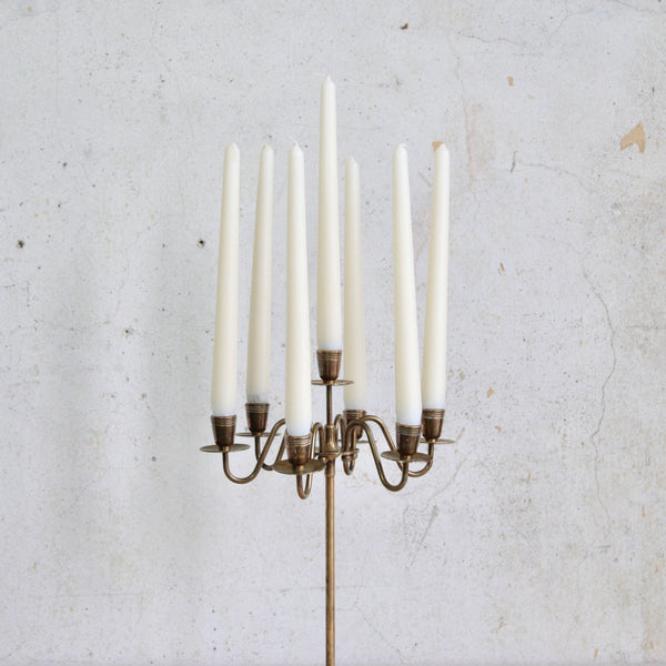 Head on shot of the top half of a Swedish vintage brass candelabra with seven lights, 1950s mid-century design for stylish interiors.