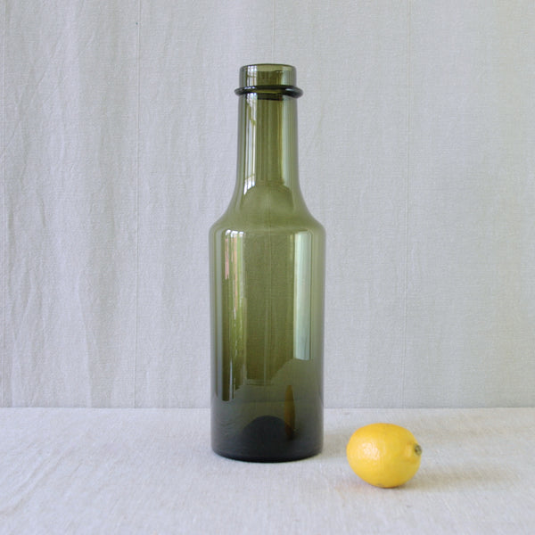 Tapio Wirkkala Rengaskaula Ring-Neck bottle for Iittala, its restrained elongated form recalling the proportions of an antique glass bottle.