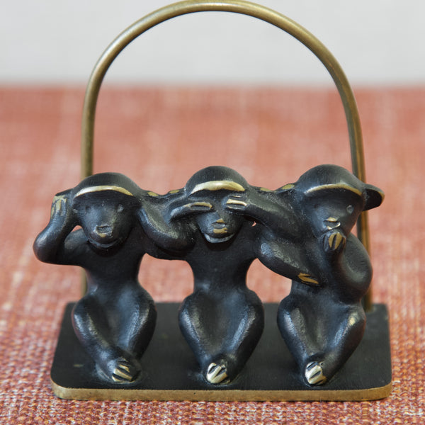 Stylised three monkeys letter rack designed by Walter Bosse for Baller Austria. Made from patinated brass, part of the 'black-golden' line, 1950's.