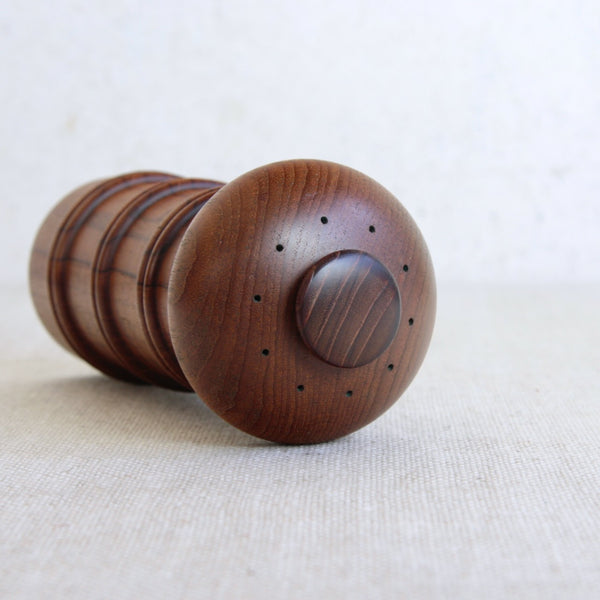 Detail of holes on a salt shaker where salt comes out from. Collectible Scandinavian tableware pepper mill by Jens Quistgaard for Dansk.