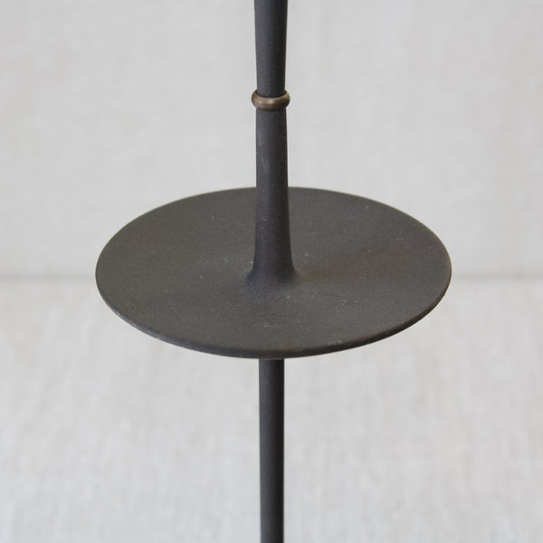Top down image looking into the tray, dish, or bowl of a "Satellite" candlestick designed by Jens Quistgaard. The proportions of this designs are exquisite. The piece is an exemplary Scandinavian design that displays Organic Modernism.