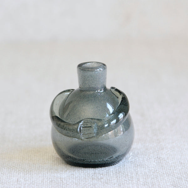 Erik Höglund Carborundum glass figure bottle for Boda, Sweden, admired for its handcrafted character and subtle iridescence.