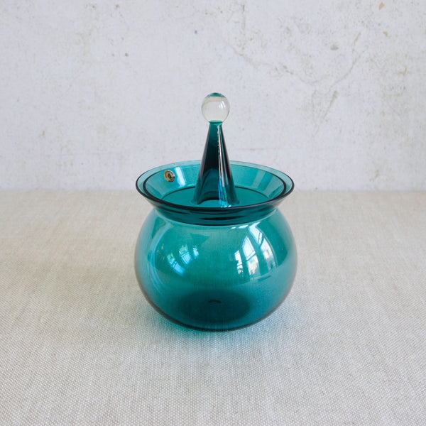 Top down view of a Nanny Still Harlekiini series glass bowl with clear ball finial, handmade by Riihimäen Lasi in Finland.