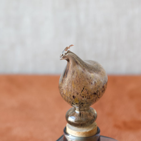 A Nuutajärvi Notsjö model KF254 hen bottle, the small square decanter adorned with a hen has an aesthetic appeal and rarity that makes it a thoughtful and unique gift option for a collector of Kaj Franck at special occasions.