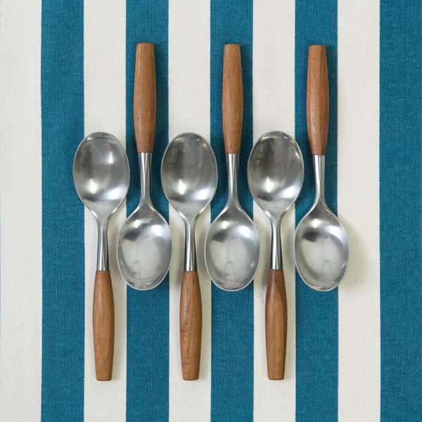 Set of six large dinner or soup spoons by Jens Quistgaard. The shape of the handles and bowls of the spoons are organic and sculptural but they are also very ergonomic.