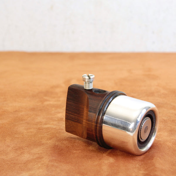 Top down view of a Modernist pepper mill by Jens Quistgaard for Dansk Designs, featuring clean lines and a tactile form.